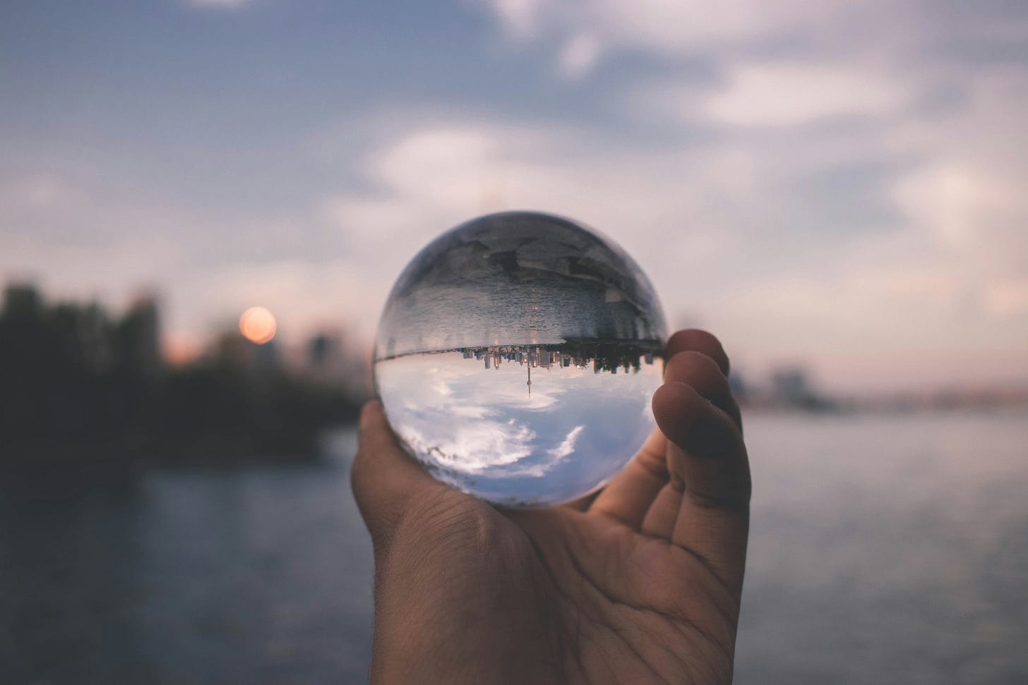 A glass orb with a mirror image of the background. 