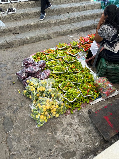 A collage showing fruit and vegetables for sale at the Etla market.