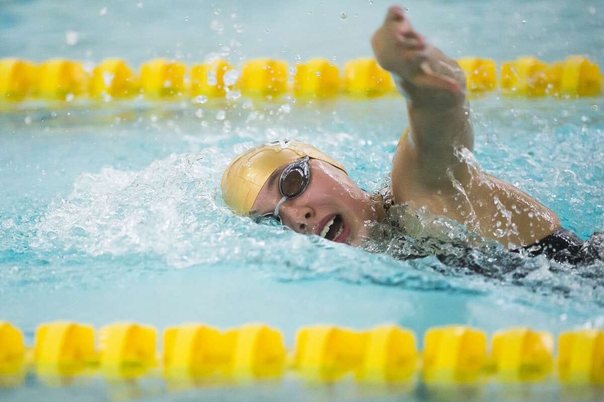 Dow High's Ella Roberson competes in the 100 freestyle during a meet in the 2020 season.