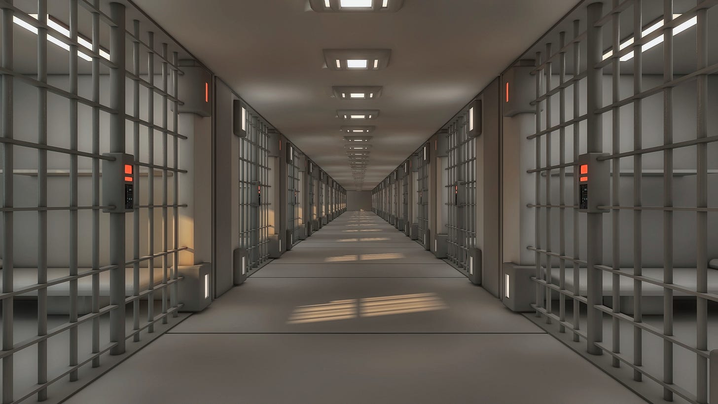 A grim, gray photo of a prison corridor with empty cells on each side A grim, gray photo of a prison corridor with empty cells on each side
