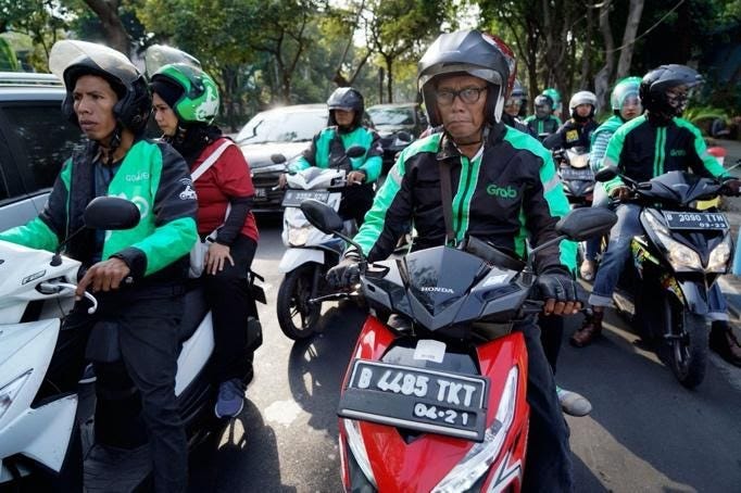 A group of people riding on the back of a motorcycle
Description automatically generated A group of people riding on the back of a motorcycle
Description automatically generated