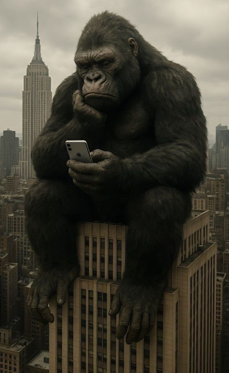 This may contain: a gorilla sitting on top of a tall building holding a cell phone in his hands