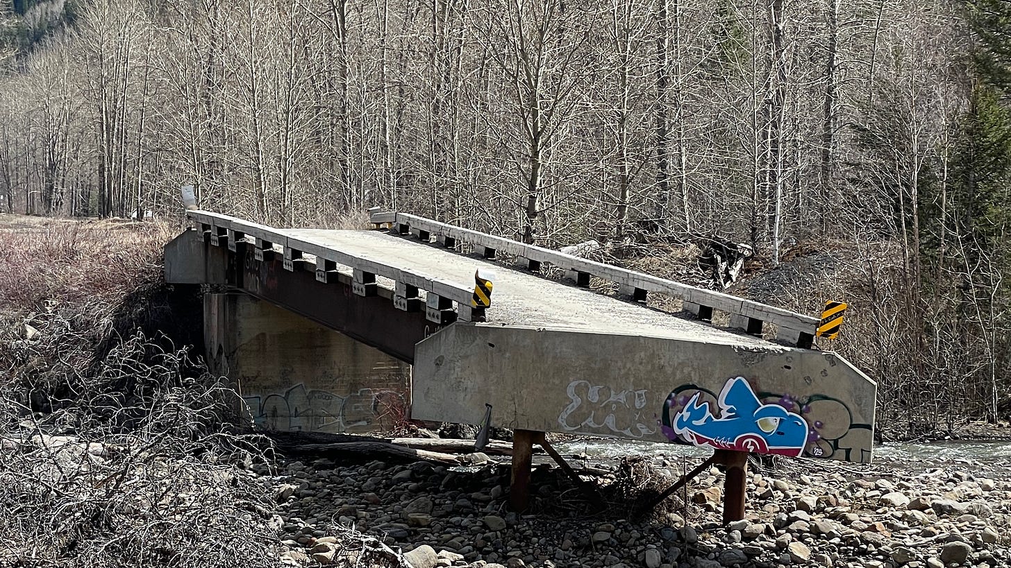 Close up of collapsed bridge and graffiti