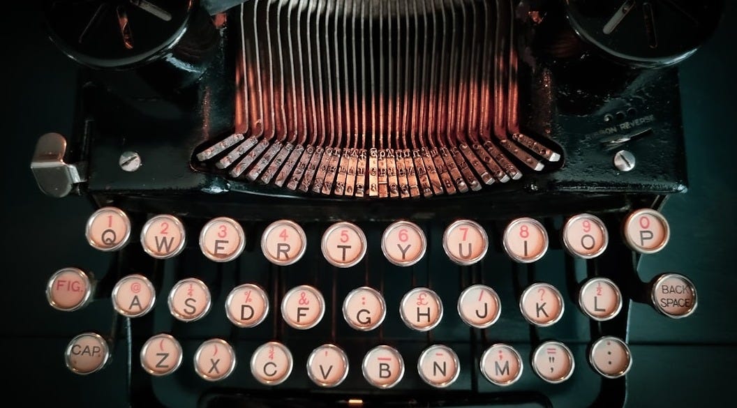 a close up of an old fashioned typewriter a close up of an old fashioned typewriter