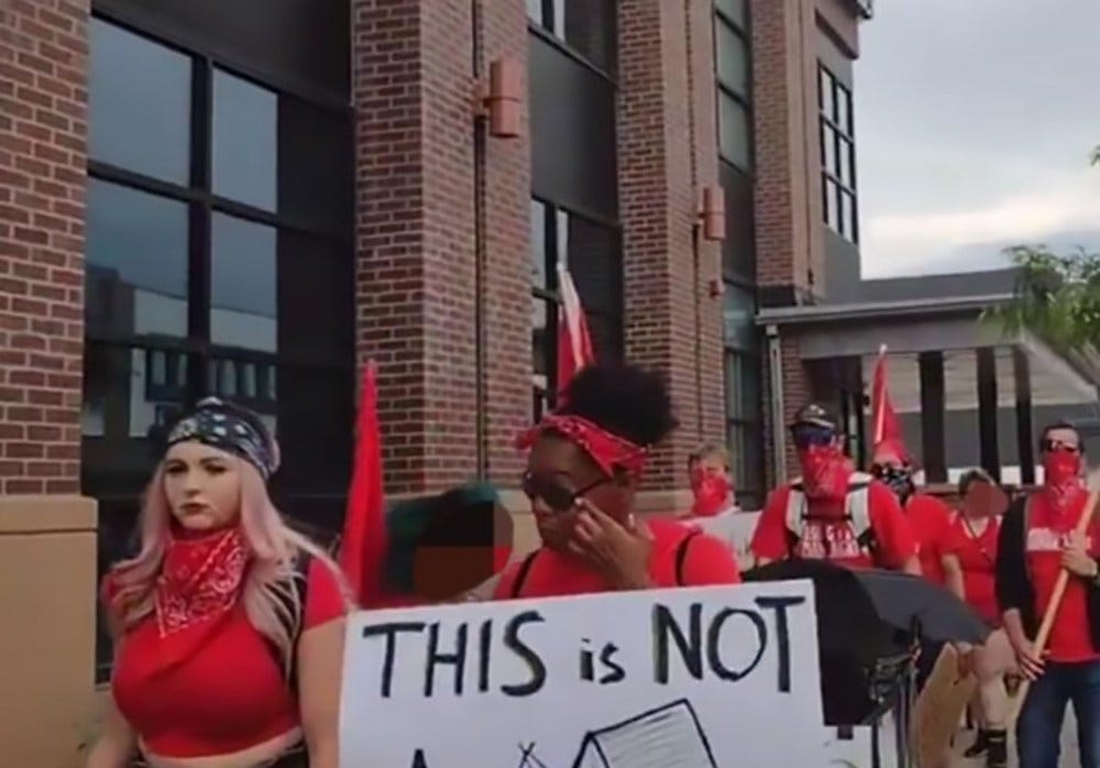 April Rogers (left), a police officer who went undercover for the FBI in the Colorado Springs activist community, participated in a housing-rights march during which several activists were arrested. April Rogers (left), a police officer who went undercover for the FBI in the Colorado Springs activist community, participated in a housing-rights march during which several activists were arrested.