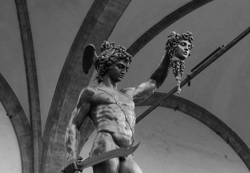 a black and white photo of a statue