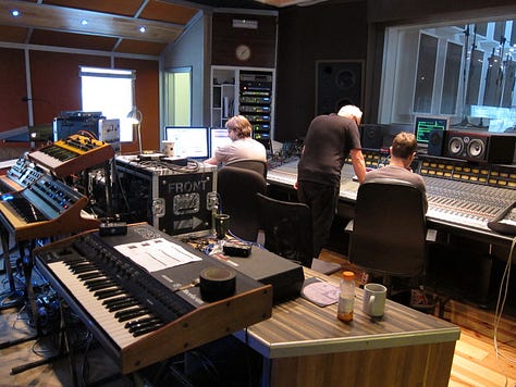 Inside a recording studio with lots of analog synthesisers. James Mottershead, Mark Cleator and Simon Campbell