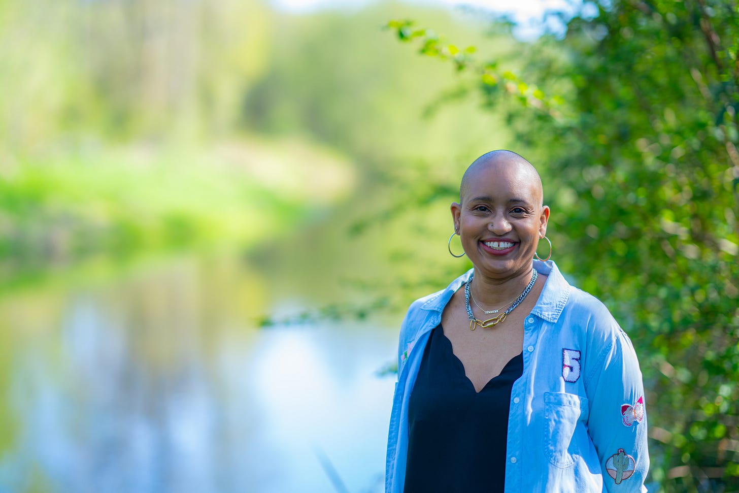 brittany miles outside smiling at camera next to trees