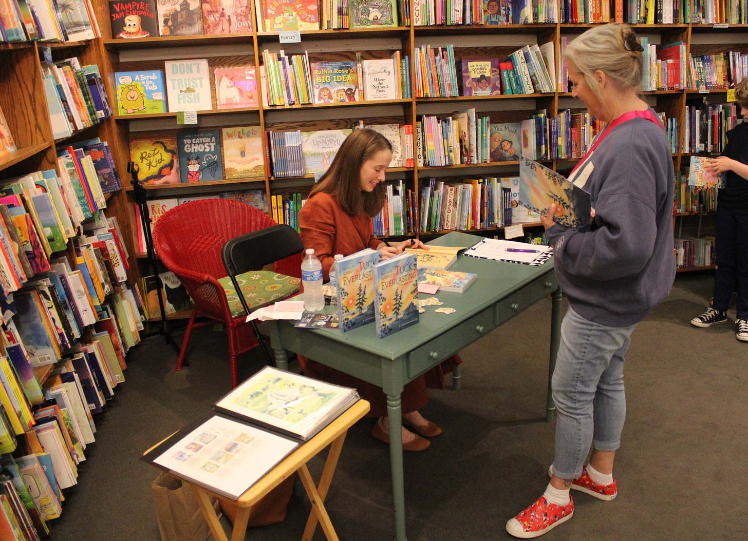 Signing books at my amazing book launch this September for Tuck Everlasting: The Graphic Novel.