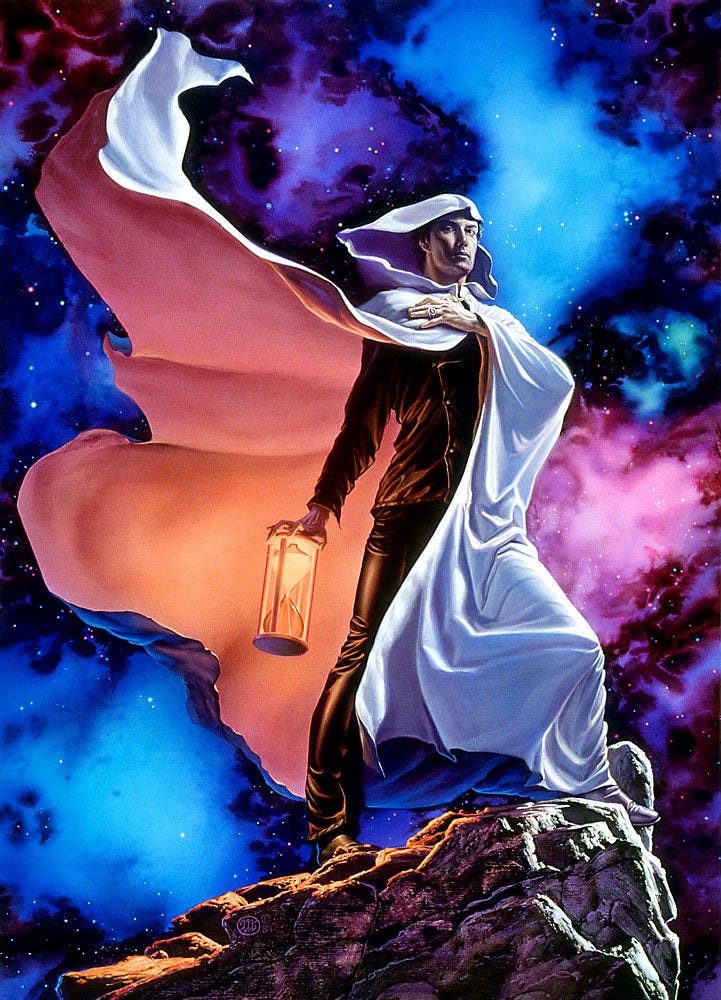 With regal bearing, a man in a hooded white cloak stands against a celestial backdrop of vibrant pink, blue and purple. He holds one hand across his chest as his cloak flutters to reveal his black leather shirt and trousers beneath. In his other hand he grips the top of an hourglass turned so the sand is situated in the top bell to spill down. The sand glows and tints the inside of his cloak peach. With regal bearing, a man in a hooded white cloak stands against a celestial backdrop of vibrant pink, blue and purple. He holds one hand across his chest as his cloak flutters to reveal his black leather shirt and trousers beneath. In his other hand he grips the top of an hourglass turned so the sand is situated in the top bell to spill down. The sand glows and tints the inside of his cloak peach.