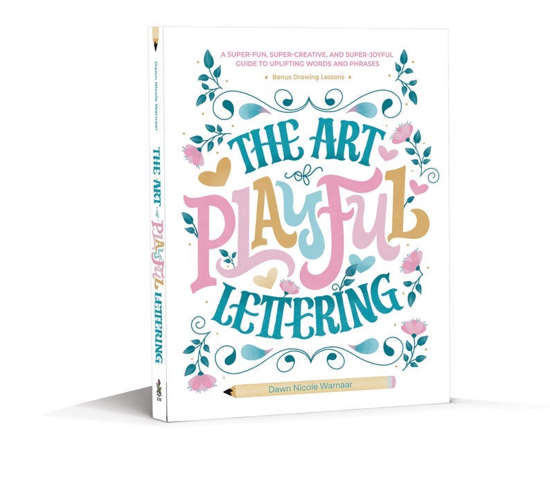 May include: Book cover with a colorful illustration of the words "The Art of Playful Lettering" with a pencil on the bottom. The book is by Dawn Nicole Warnaar.