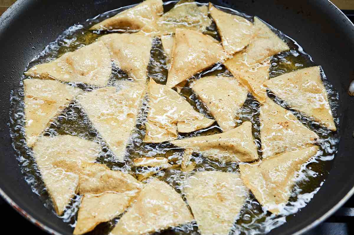 frying tortilla chips in pan
