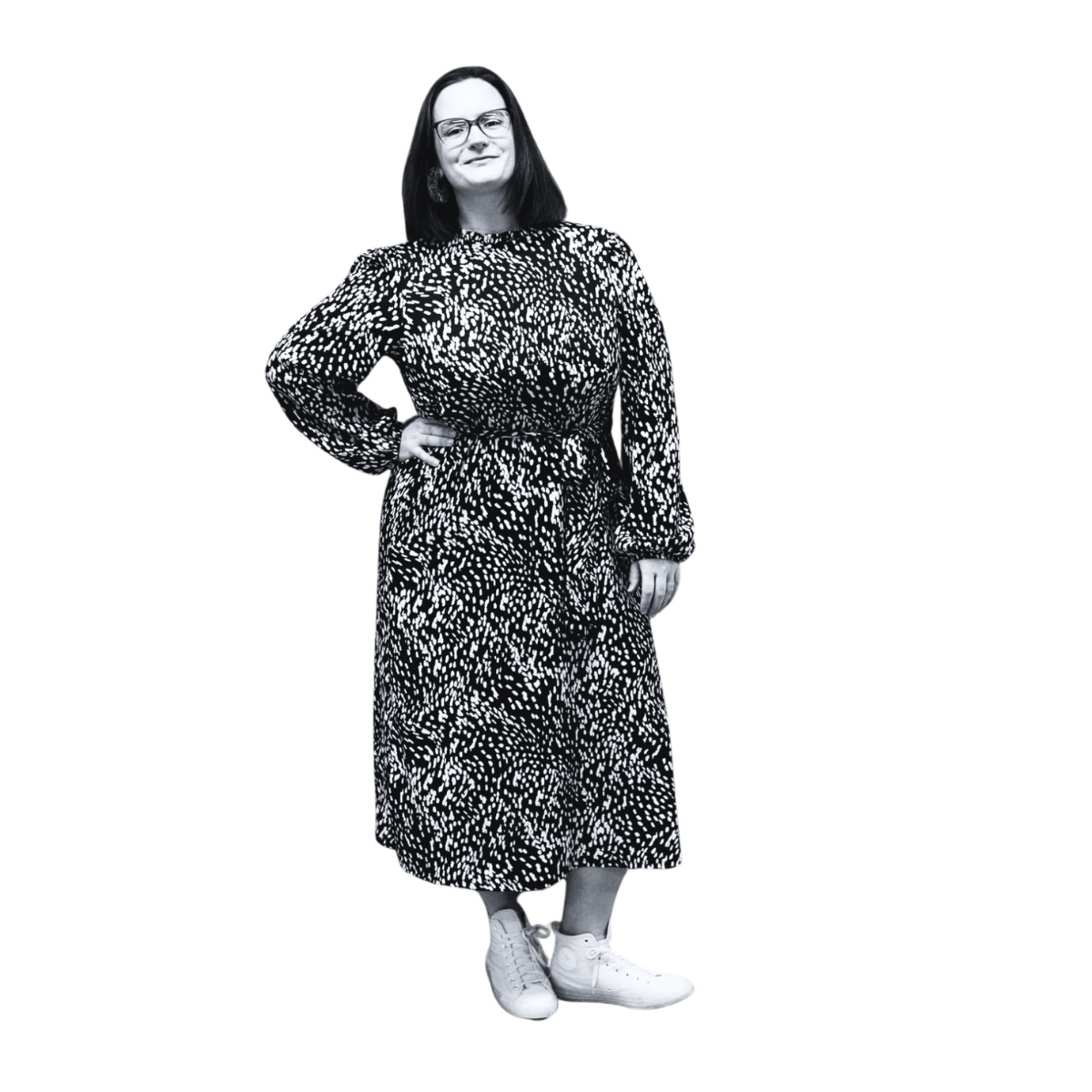 Mel Barfield in black and white in a black and white dress and glasses