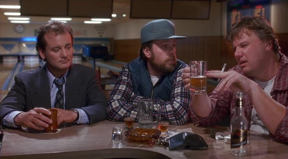 Phil Connors drinking with locals at the bowling alley