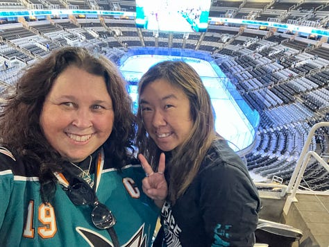 Photo 1: Image of woman in Sharks jersey smiling outside arena; Photo 2: Image of Joe Thornton ice sculpture; Photo 3: Image of Joe Thornton coming through Shark head on ice; Photo 4: image of two women smiling with ice rink behind them; Photo 5: Image of Shark head and chairs on ice for ceremony; Photo 6: Image of Joe Thornton on big screen; Photo 7: Image of Thank You Joe box where jersey was raised with family behind it; Photo 8: Image of ice rink with Shark head and players; Photo 9: Image of #12 and #19 jersey's hanging in the rafters of the arena