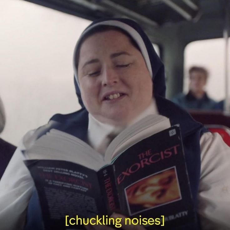 This may contain: a woman reading a book while sitting on a bus with other people in the background