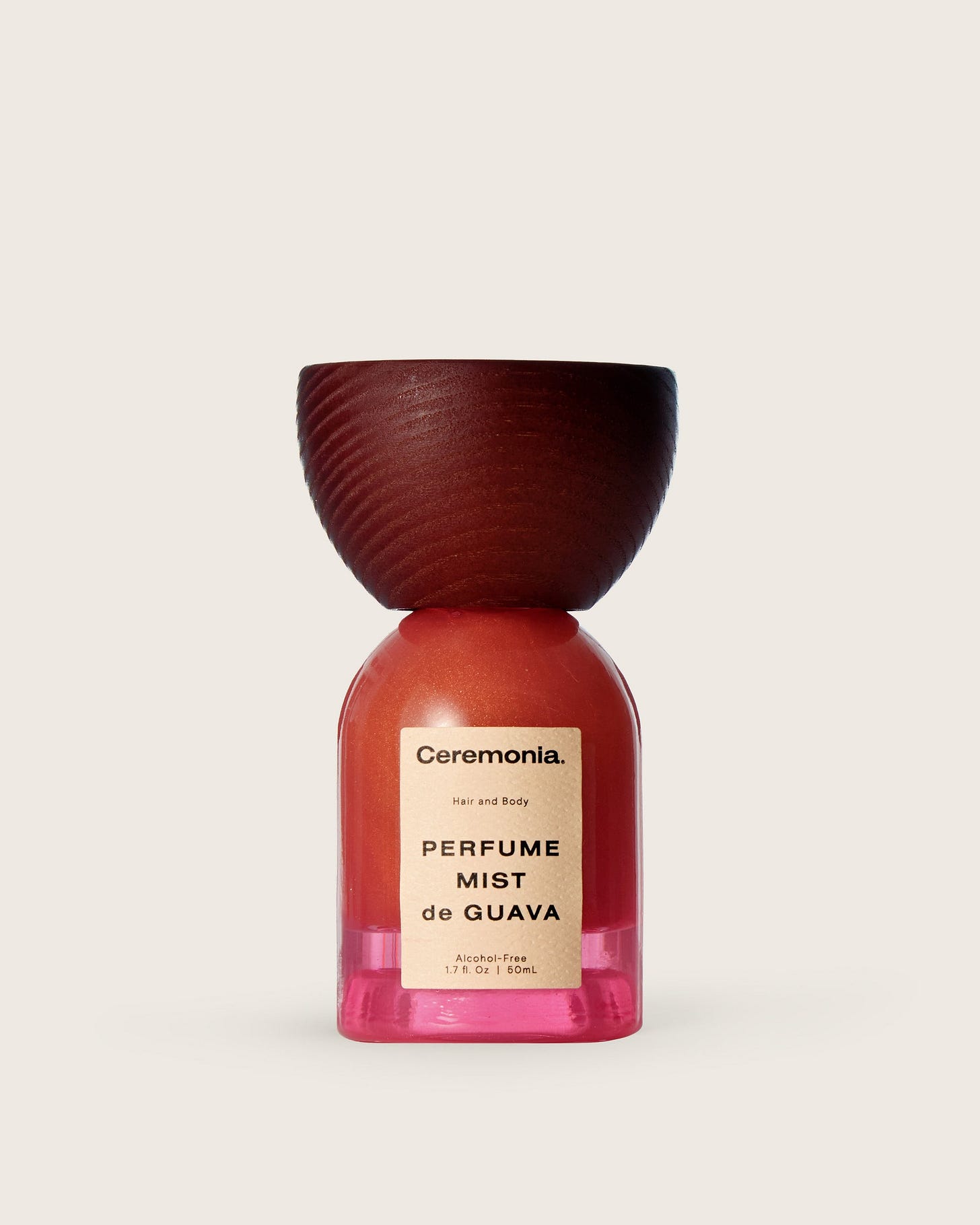 Guava perfume mist for hair and body in a pink bottle with a wooden cap and alcohol-free formula. Guava perfume mist for hair and body in a pink bottle with a wooden cap and alcohol-free formula.