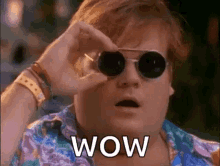 wow gif of a man flipping his sunglasses up