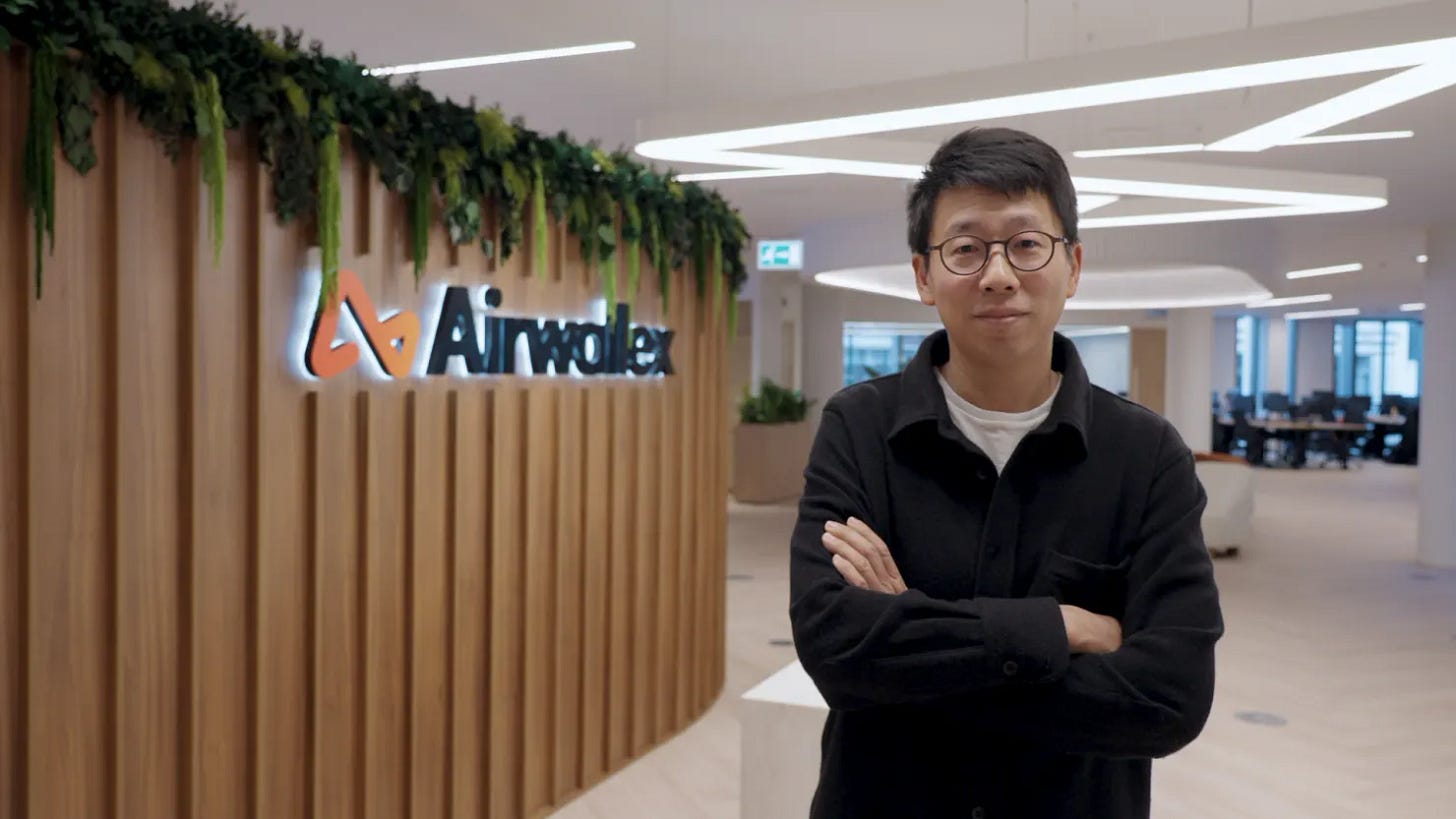 Jack Zhang, CEO of Airwallex, standing in front of the illuminated Airwallex logo at the company's headquarters Jack Zhang, CEO of Airwallex, standing in front of the illuminated Airwallex logo at the company's headquarters