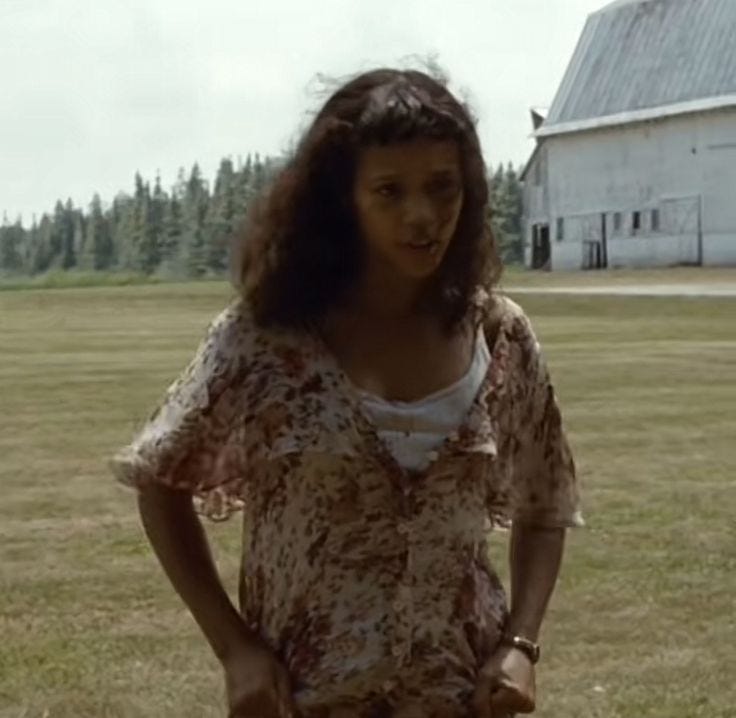 A person standing in a field

Description automatically generated