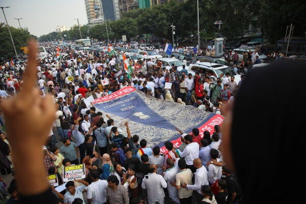Activists and workers from various opposition parties carry a large replica of the Constitution of India during a protest march toward the Supreme Court demanding the resignation of Chief Election Commissioner Gyanesh Kumar in New Delhi, India, Monday, Oct. 12, 2026.. (AP Photo/Prabhat Mehrotra) Activists and workers from various opposition parties carry a large replica of the Constitution of India during a protest march toward the Supreme Court demanding the resignation of Chief Election Commissioner Gyanesh Kumar in New Delhi, India, Monday, Oct. 12, 2026.. (AP Photo/Prabhat Mehrotra)