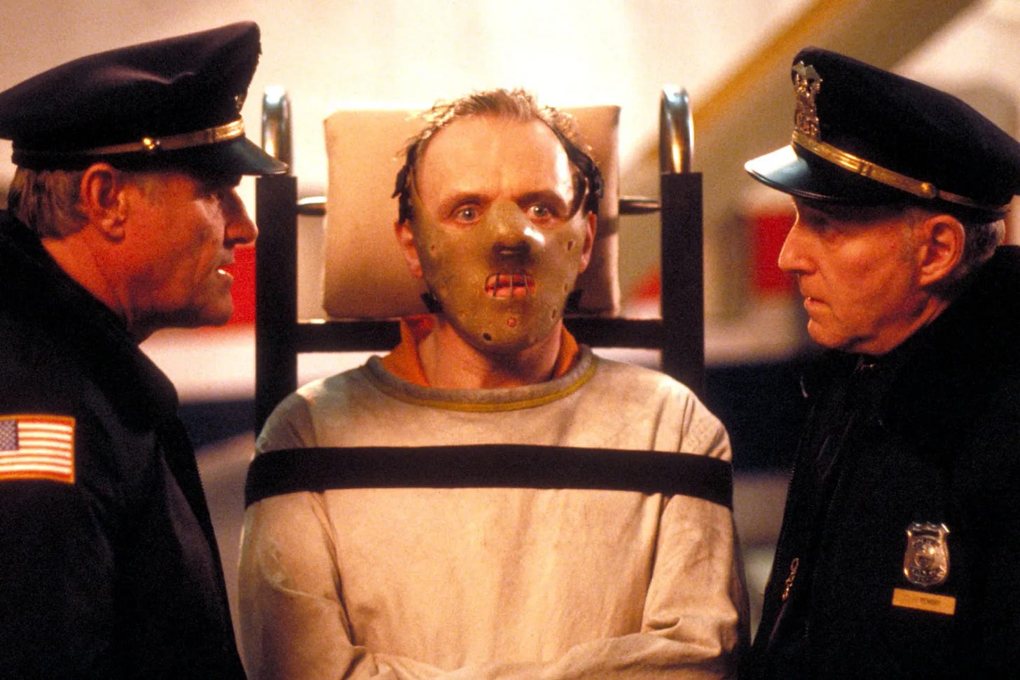 Hannibal Lector and two cops in Silence of the Lambs