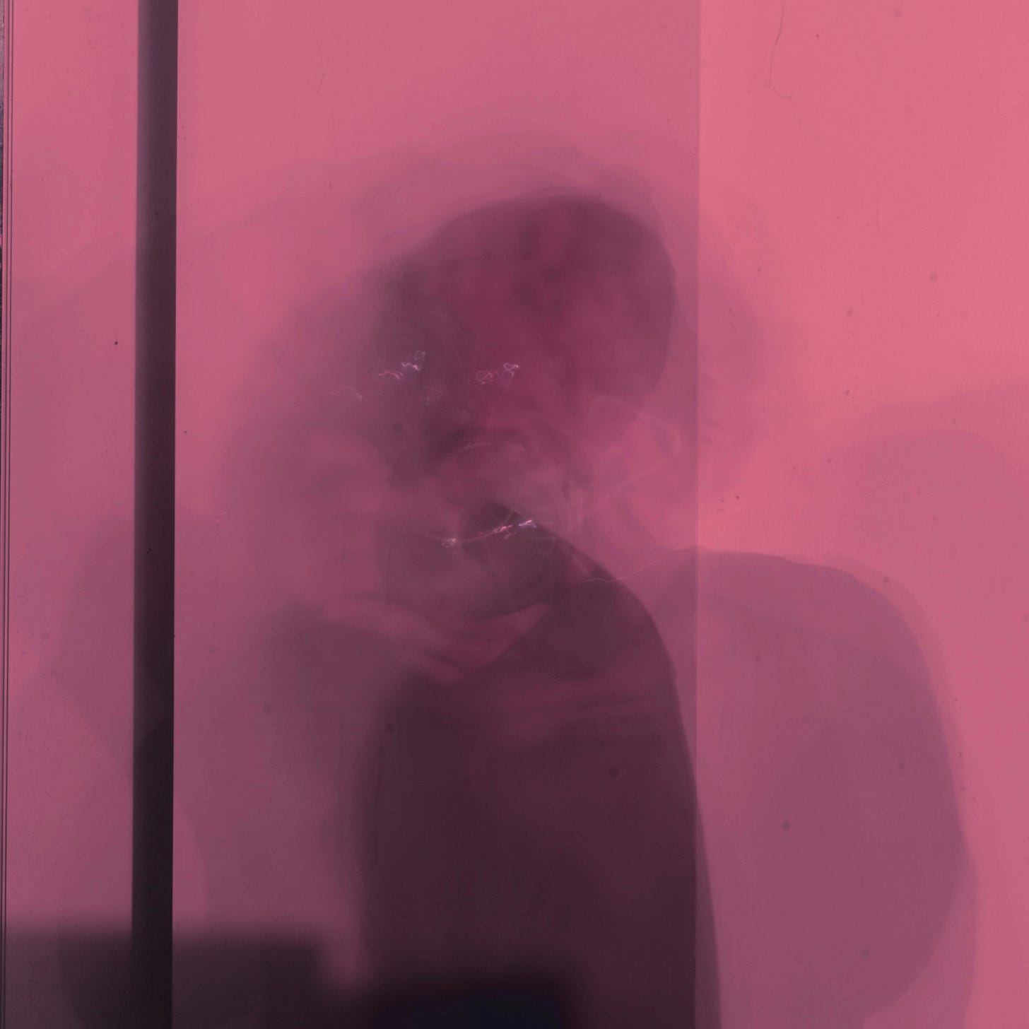 Blurred image of man sitting on chair