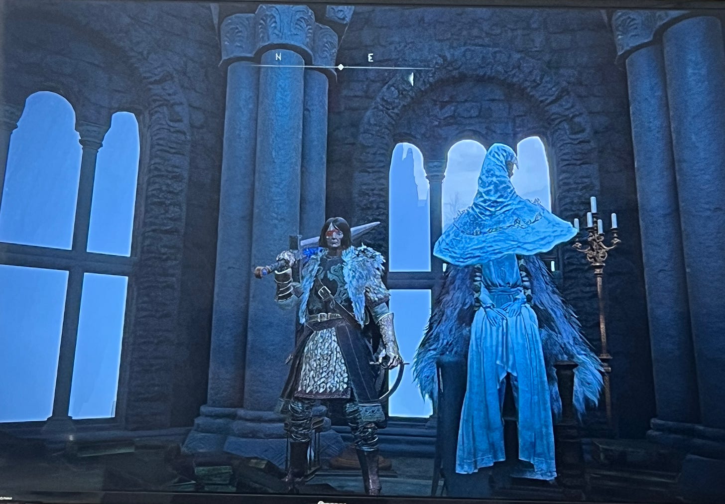 Warrior with large sword and witch dressed in white