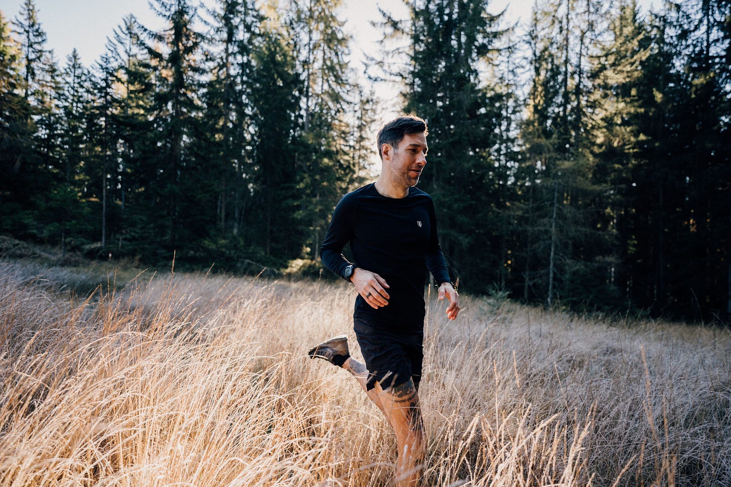 The author running through a field of grass