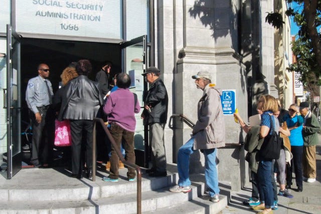 People lined up outside a social security office