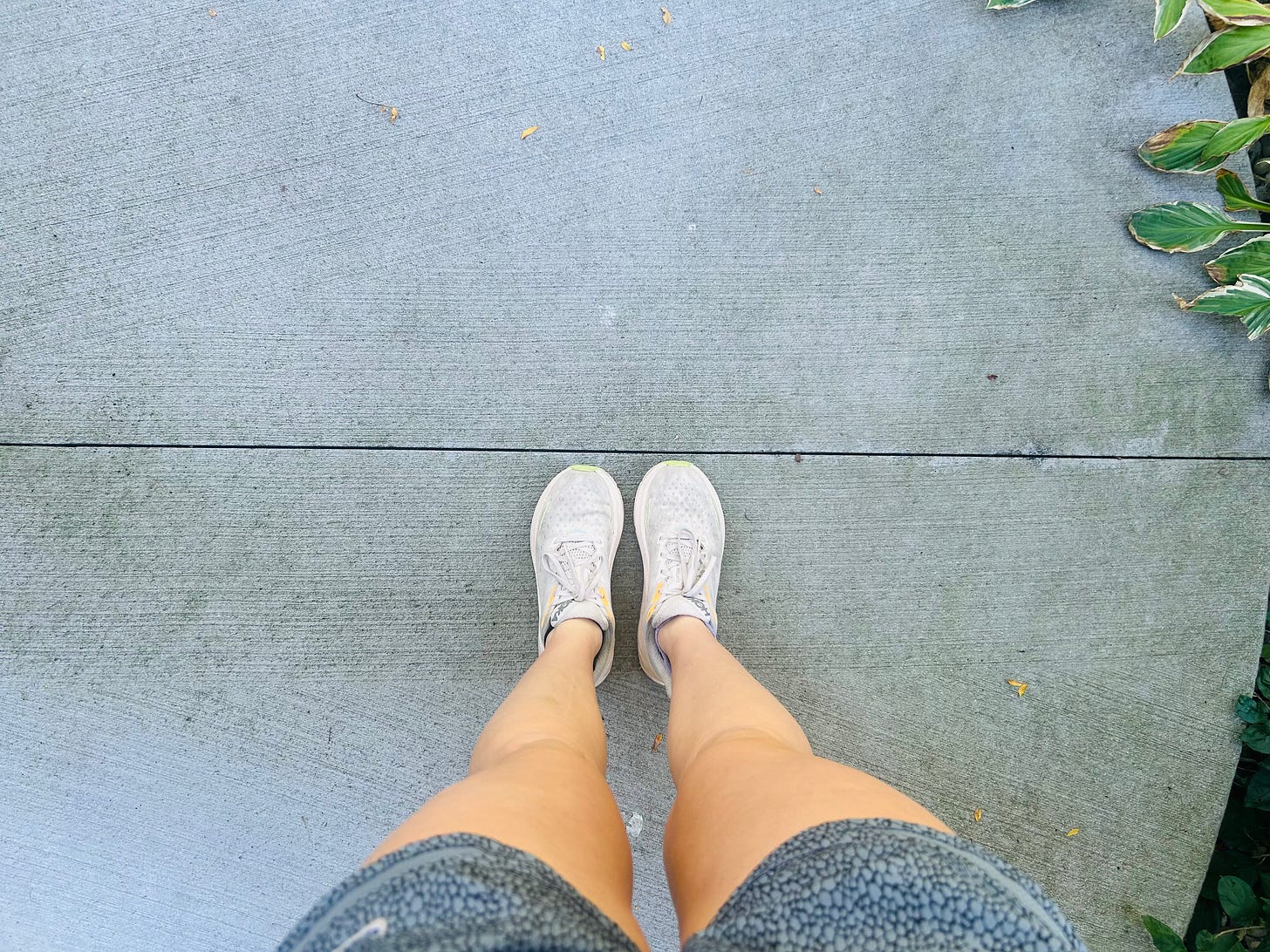 Picture shows Lisa looking down at her running shoes. Picture shows Lisa looking down at her running shoes.