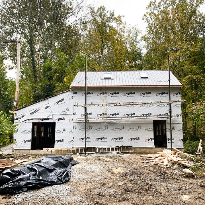 Putting on a new roof and adding the siding to the new barn.