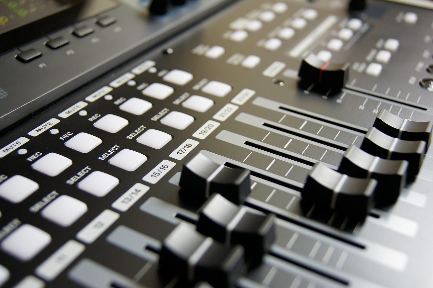 DJ sound controller board with sliders.