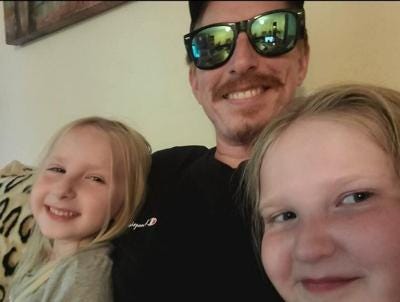 Peter Warrel of Richmond Hill and his daughters