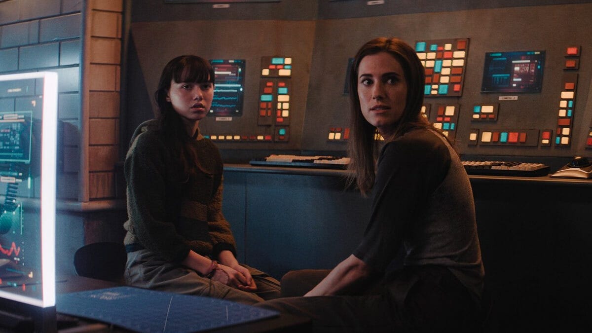 Williams and McGraw look with concern in the underground lair they've found themselves in. Williams and McGraw look with concern in the underground lair they've found themselves in.