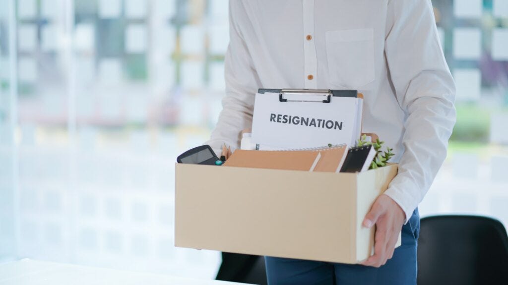 The office worker is packing things after resigning from work.