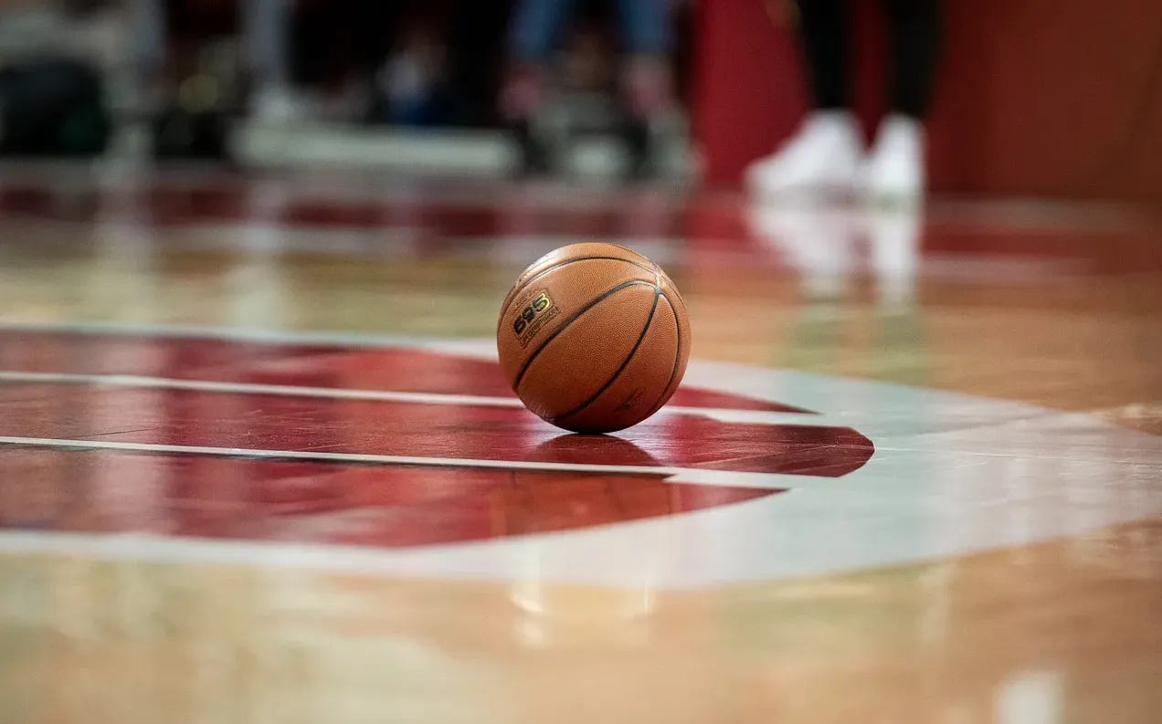 A Wisconsin Badgers basketball sits on the Kohl Center court before a game. Photo credit: Aaron Frey-AMF Photos.