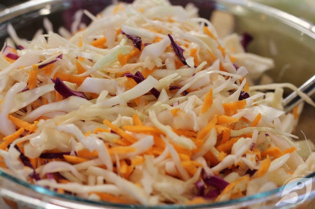 making Creamy Coleslaw green and purple cabbage with carrots making Creamy Coleslaw green and purple cabbage with carrots
