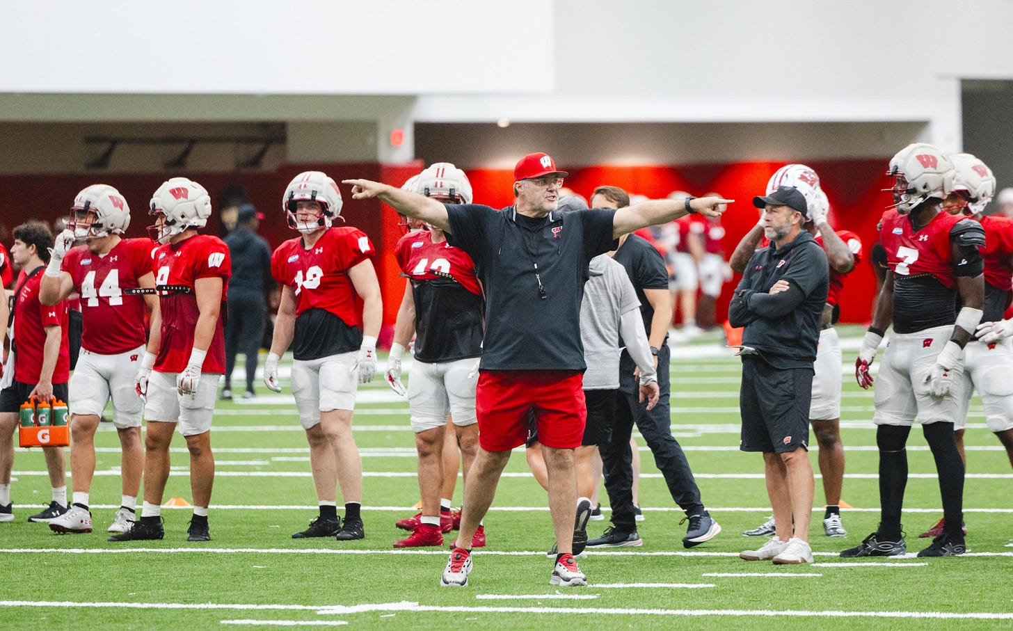 Wisconsin Badgers offensive coordinator Jeff Grimes on the field during an indoor practice. Wisconsin Badgers offensive coordinator Jeff Grimes on the field during an indoor practice.
