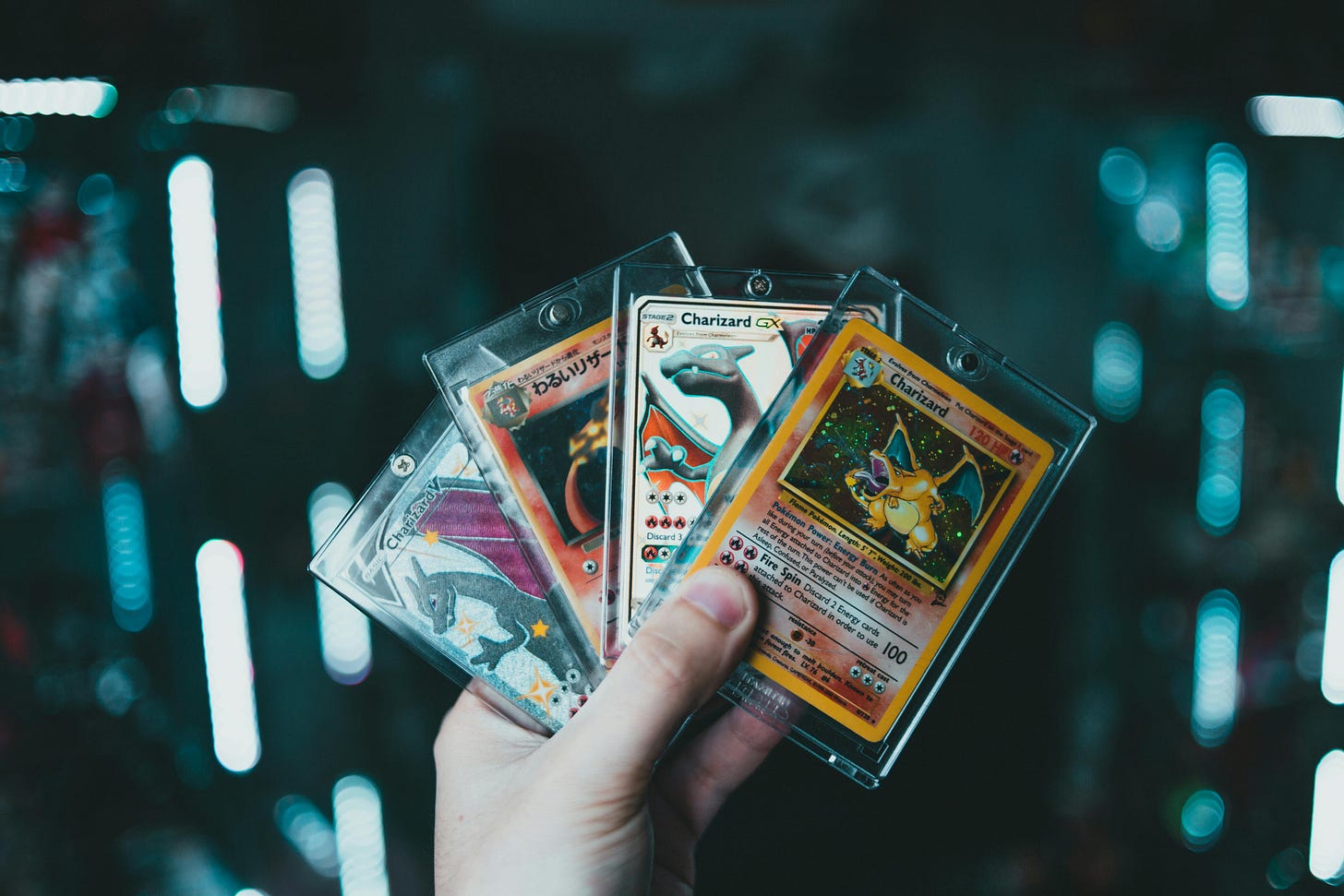 A Person Holding Pokemon Trading Cards · Free Stock Photo