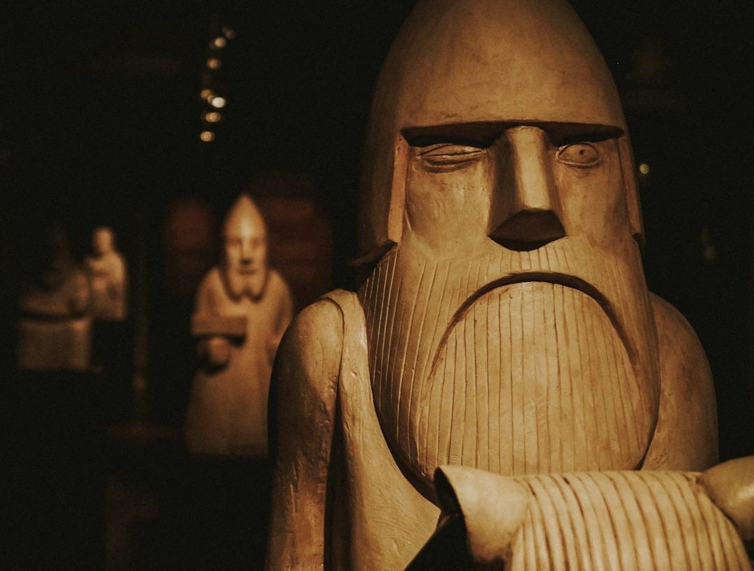 closeup photo of brown wooden statue