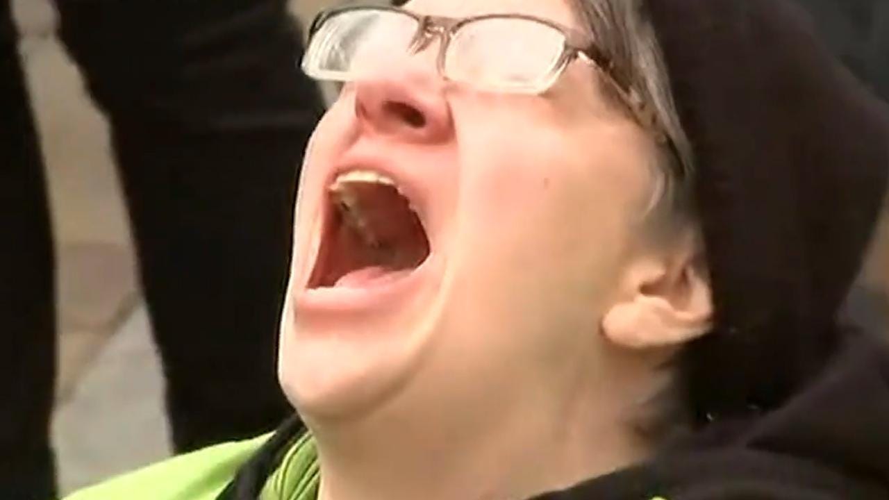 Bizarre moment anguished protester screams 'no' at the top of her lungs  just as Donald Trump is sworn in