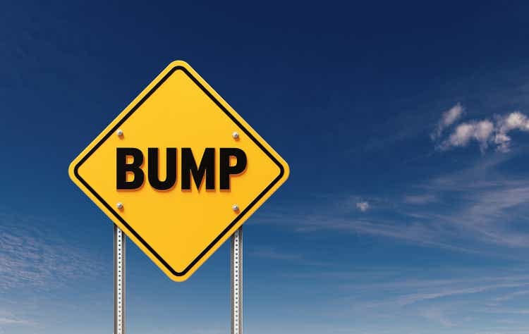 Bump Written Yellow Off Road Traffic Sign Before Blue Sky