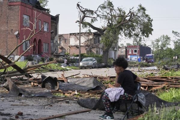People survey damage after a severe storm moved through Friday, May 16, 2025, in St. Louis. (AP Photo/Jeff Roberson) People survey damage after a severe storm moved through Friday, May 16, 2025, in St. Louis. (AP Photo/Jeff Roberson)
