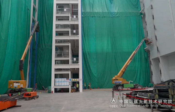 The existing Long March 8A preparation stand at the commercial launch site (left) and a new one under construction (right).