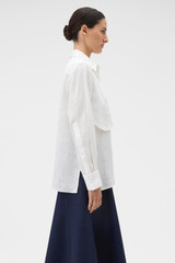 Profile view of model wearing the Oroton Stitch Detail Shirt in White and 100% linen fabric for Women