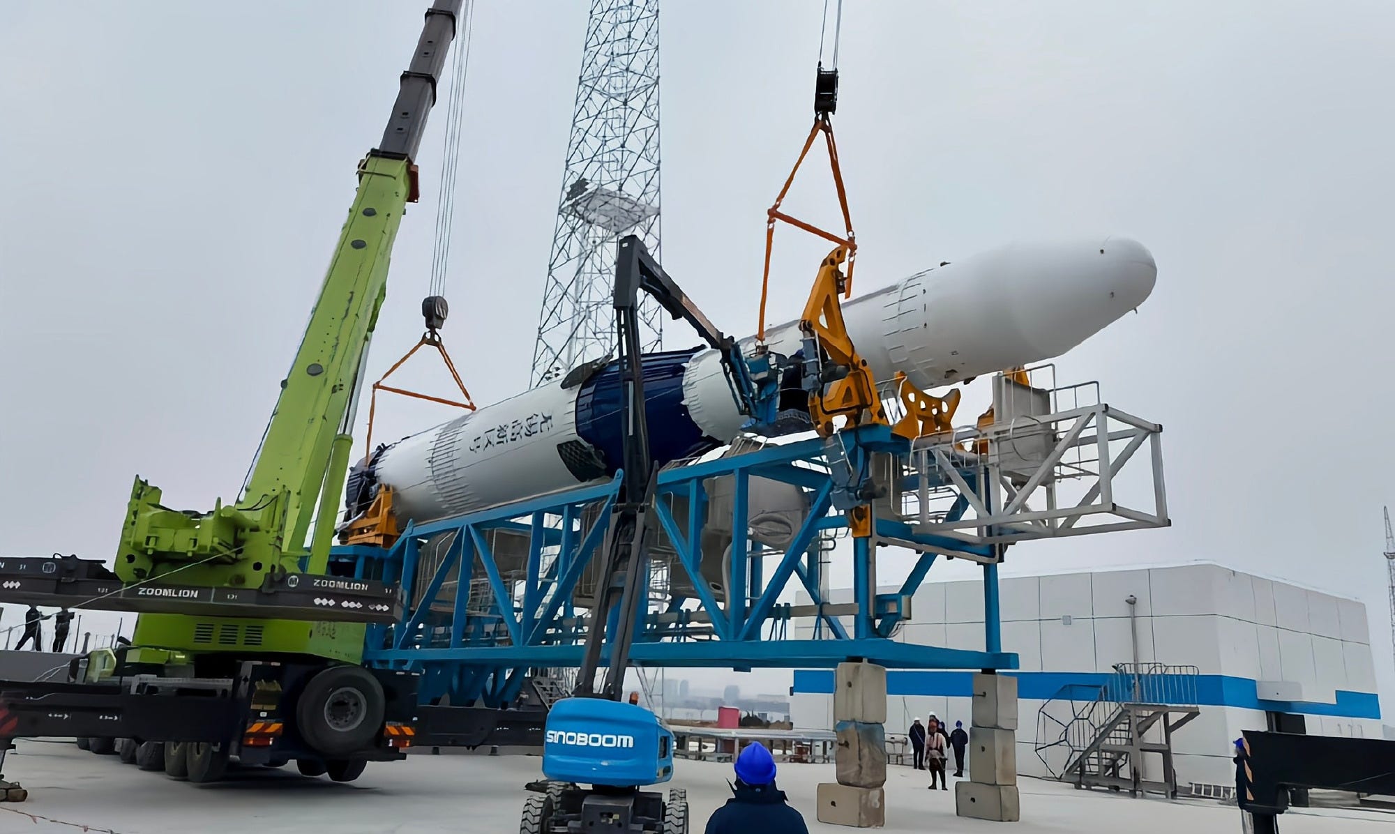 Deep Blue Aerospace’s Nebula-1A launch vehicle being placed onto a transporter-erector at Haiyang’s new liquid propellant launch pad in the second half of March 2026.