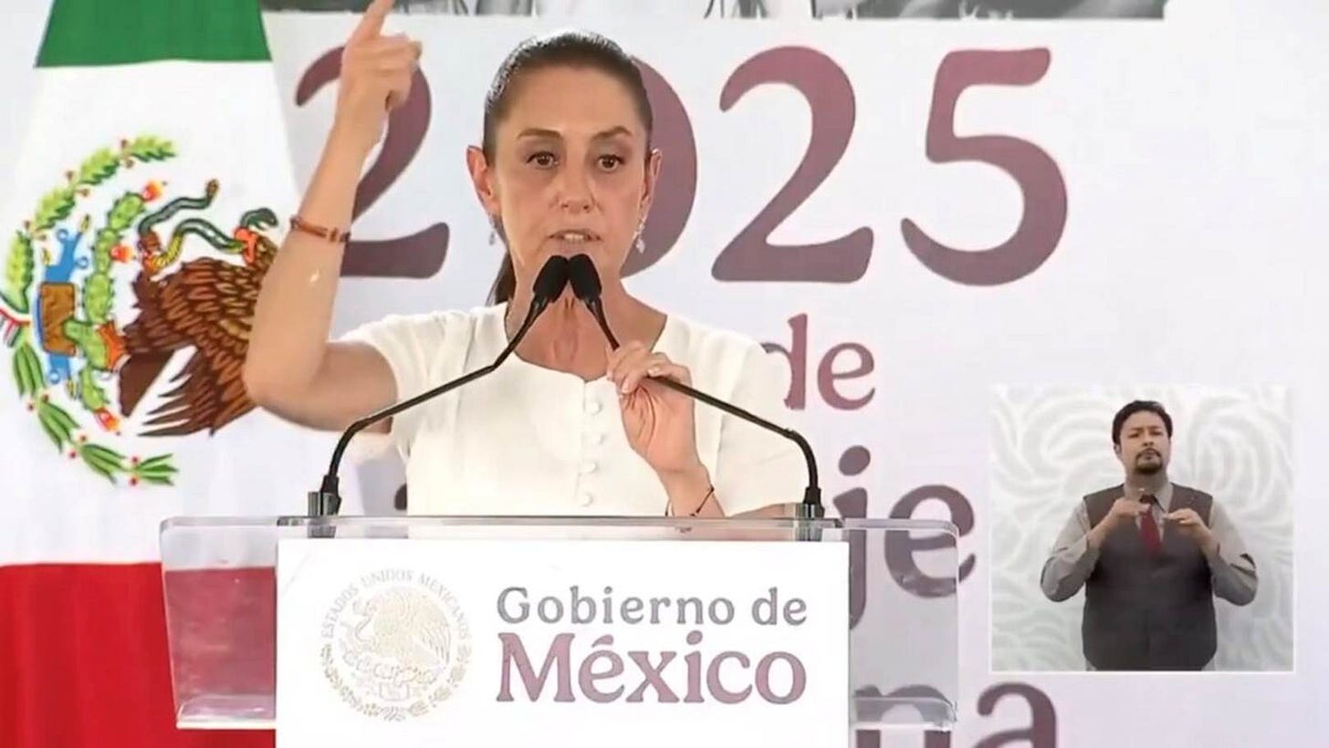 A person standing at a podium with microphones

AI-generated content may be incorrect.