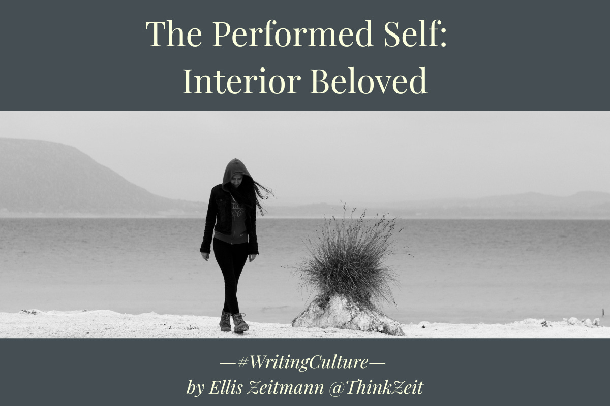 A solitary figure walks across a vast, windswept landscape in black and white, head lowered, hair caught by the wind , an image of aloneness that reads not as freedom but as the middle of a relationship, illustrating Interior Beloved, part of The Performed Self series by Ellis Zeitmann. For ThinkZeit. A solitary figure walks across a vast, windswept landscape in black and white, head lowered, hair caught by the wind , an image of aloneness that reads not as freedom but as the middle of a relationship, illustrating Interior Beloved, part of The Performed Self series by Ellis Zeitmann. For ThinkZeit.