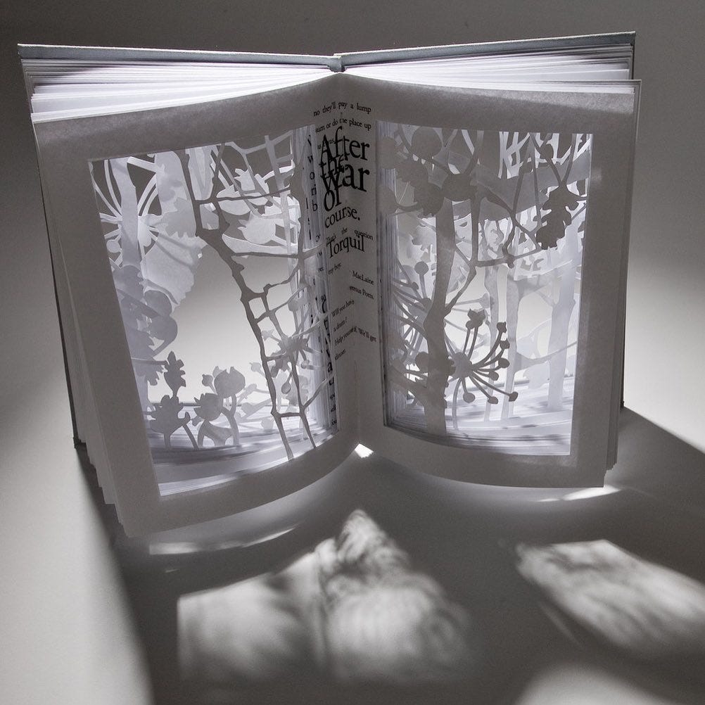 White handmade book with papercut pages by artist Sarah Morpeth, photography by Gill Moore